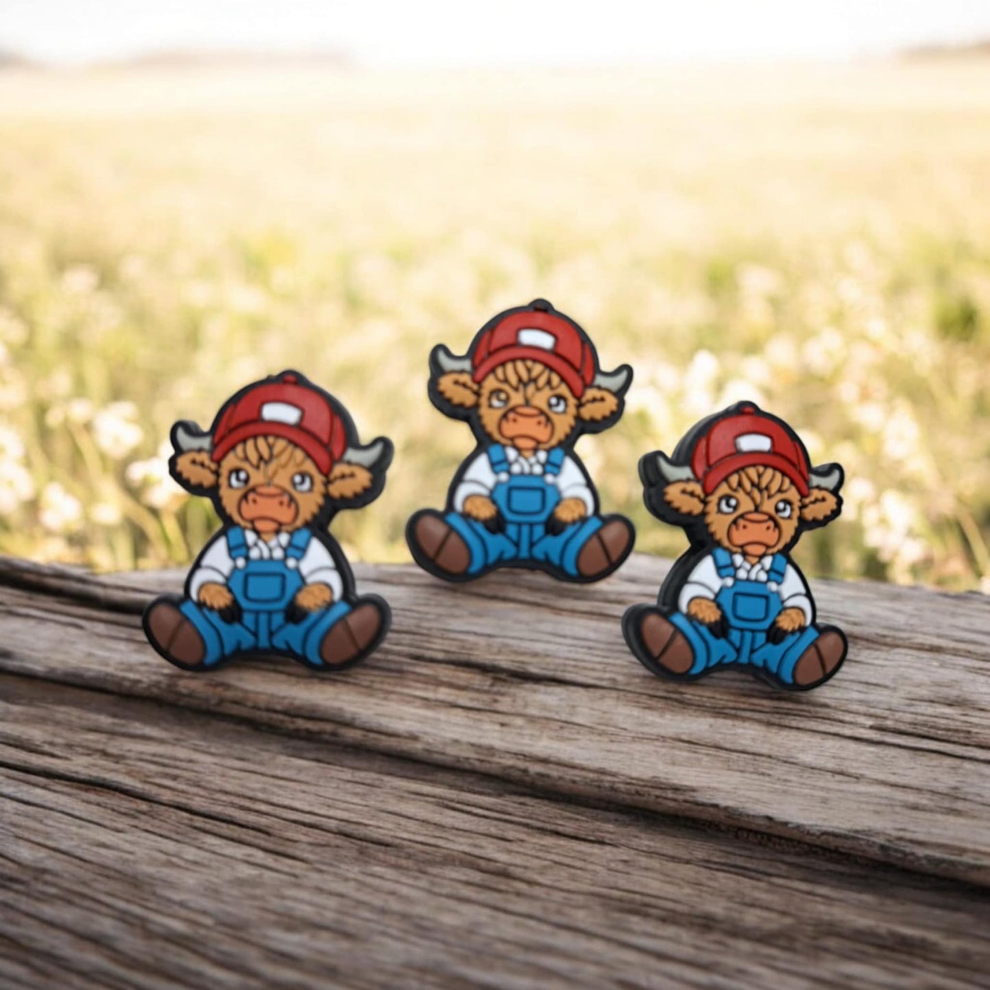 Brown Highland Cow Wearing Overalls and Red Hat Sitting Silicone Focal Bead - 1355